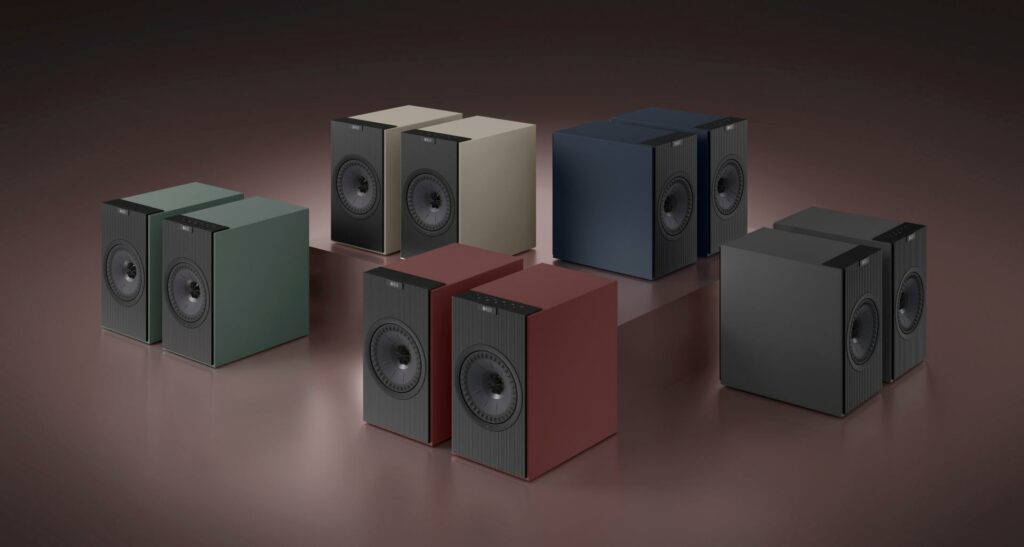 The KEF Coda W speaker system shown in all five available colourways: Sage Green, Sandy Beige, Midnight Blue, Vintage Burgundy and Graphite Grey.