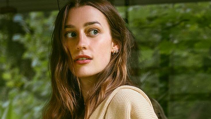 Close crop of a woman looking away from the camera